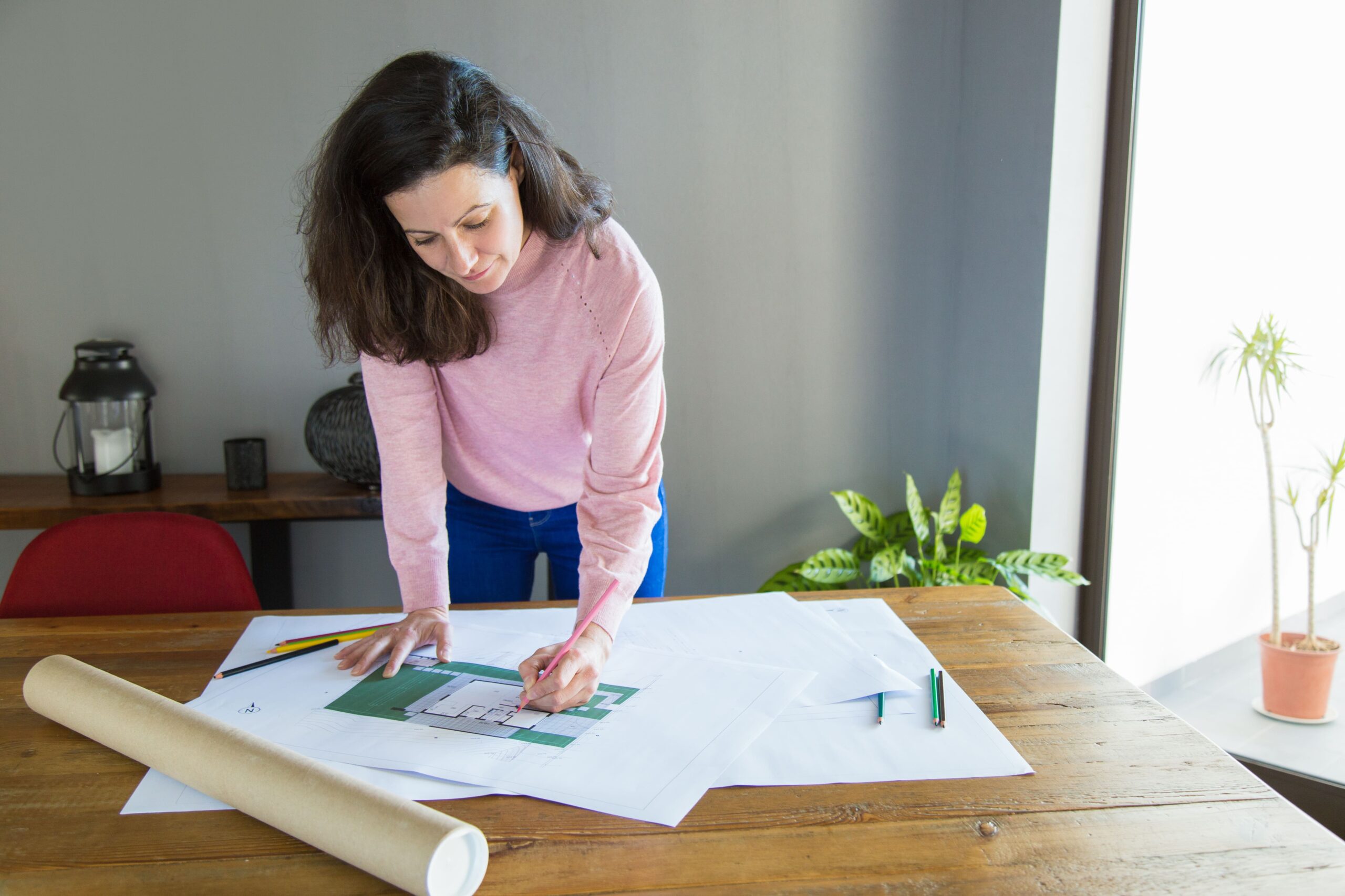 focused professional working apartment design project min scaled
