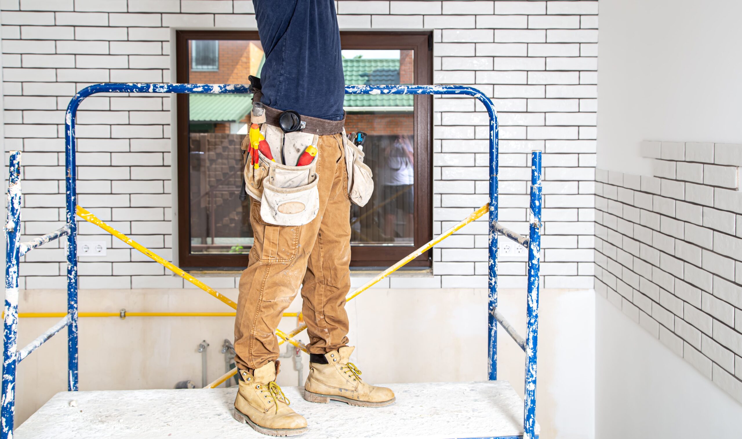 professional overalls with tools repair site min scaled